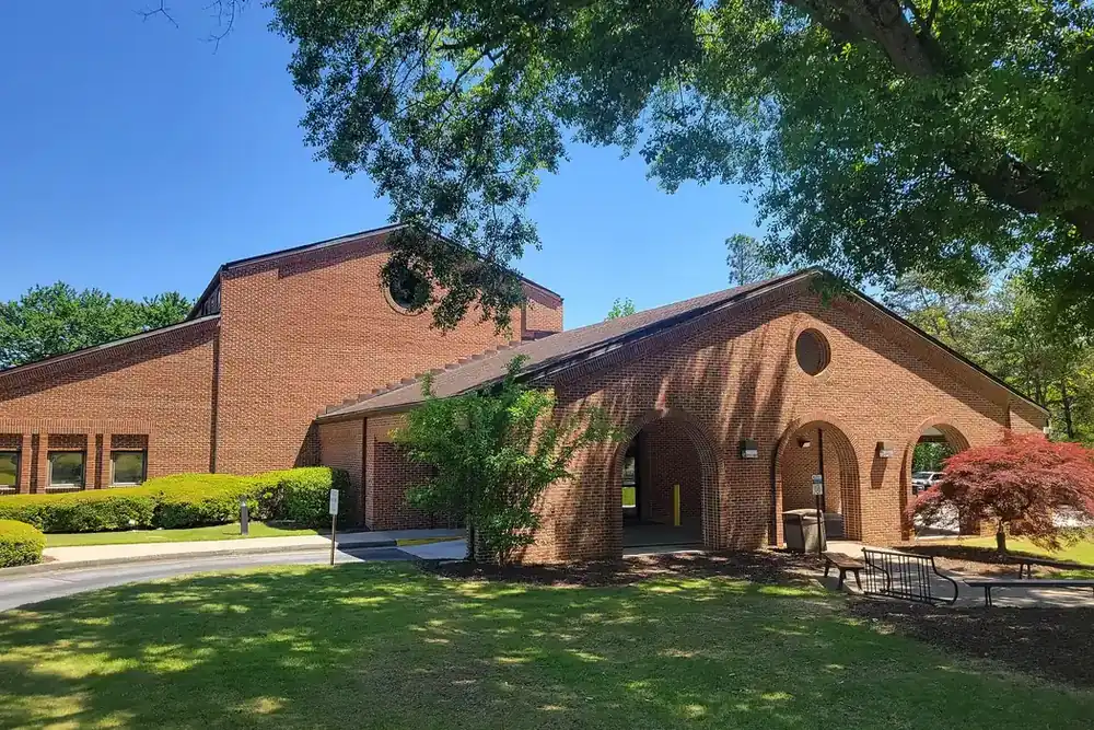 Gwinnett County Public Library branch, a brick building with arches, in Mountain Park, Georgia